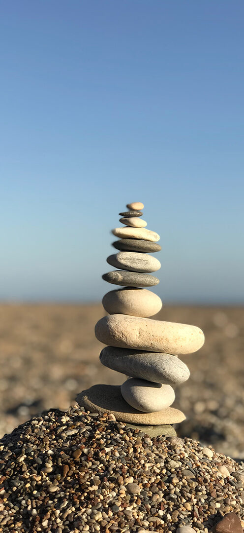 peaceful image of rocks stacked on pebbles